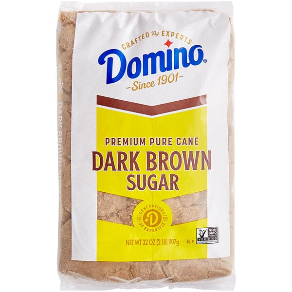 A white bag of Domino Dark Brown Sugar.