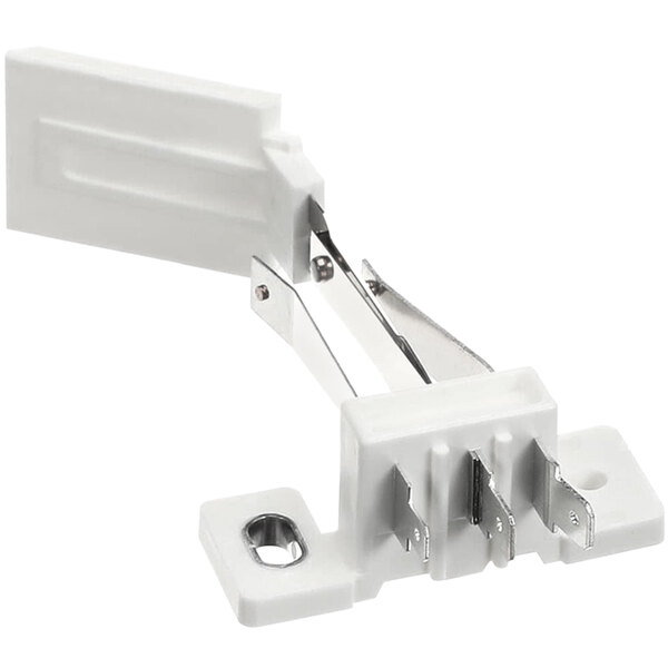 A white plastic Solwave monitor switch with metal clips.