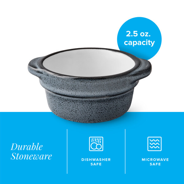 A small, midnight blue matte stoneware sauce cup with a 2.5 oz. capacity.