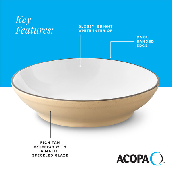 A tan matte stoneware pasta bowl with a glossy white interior and a dark banded edge.