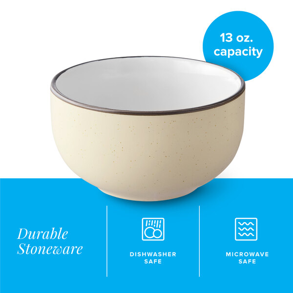 A cream white matte stoneware bowl with a 13 oz. capacity.