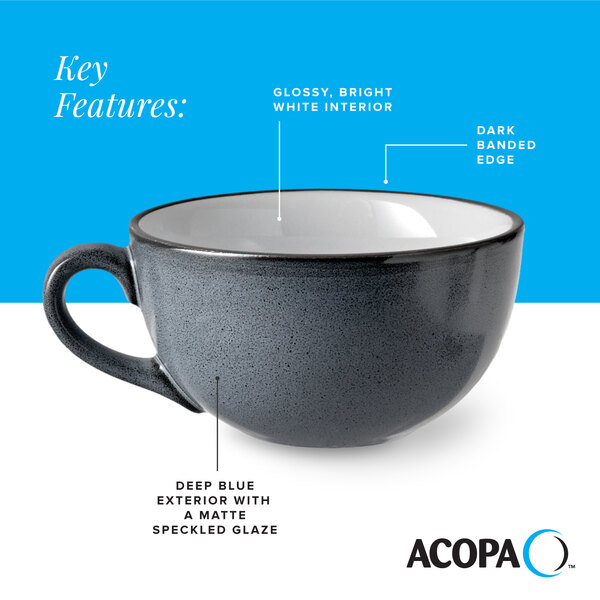 A deep blue matte stoneware cup with a glossy white interior and dark banded edge.