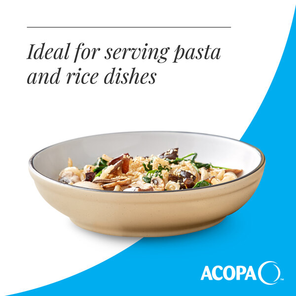 A tan matte stoneware pasta bowl filled with a pasta dish.