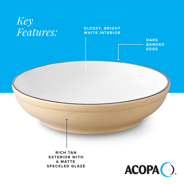 A tan matte stoneware pasta bowl with a glossy white interior and a dark banded edge.