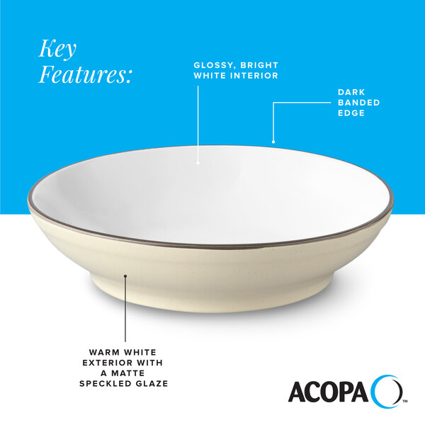 A cream white matte stoneware pasta bowl with a glossy white interior and a dark banded edge.