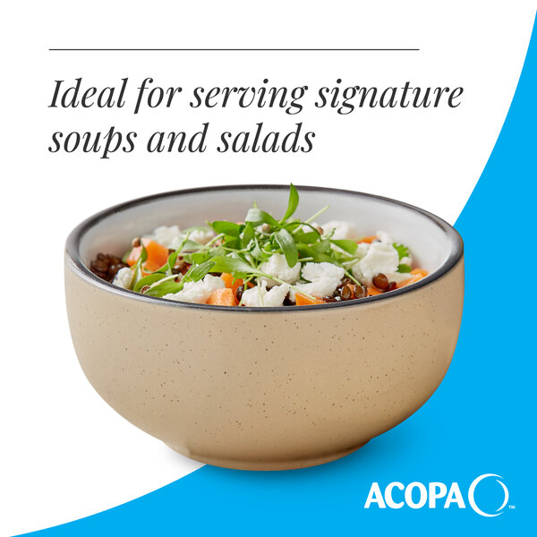 A tan matte stoneware bowl filled with salad, ideal for serving soups and salads.