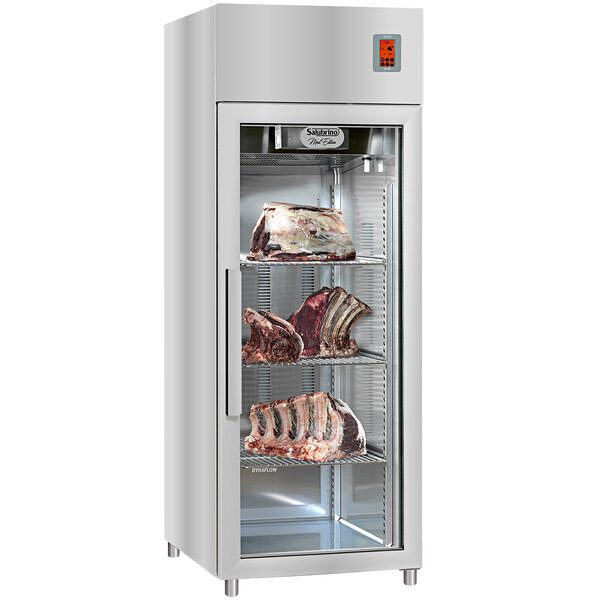 A Salubrino meat preservation and dry aging cabinet with meat on shelves.