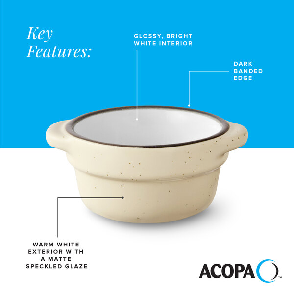 A cream white matte stoneware sauce cup with a glossy white interior, dark banded edge, and speckled exterior.