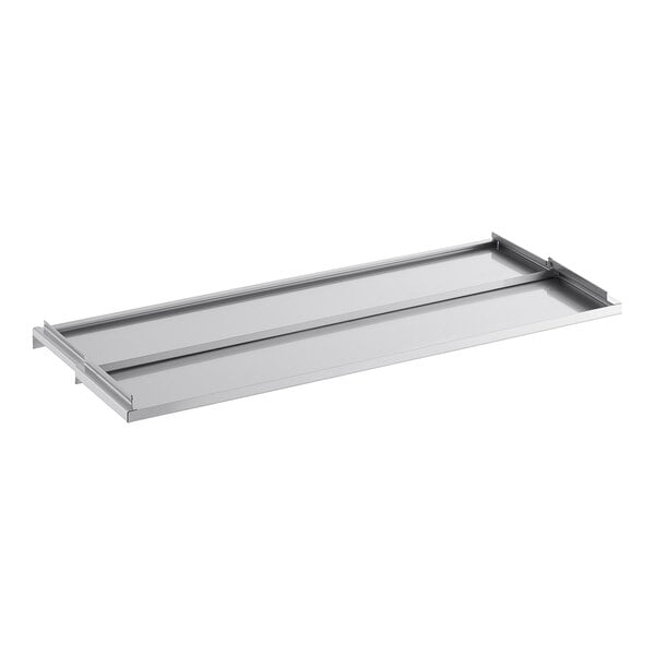 A rectangular, flat, stainless steel sliding lid with raised edges and tracks on the sides.