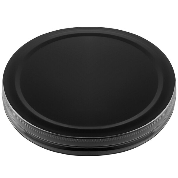 A black plastic lid for a Tablecraft beverage dispenser on a white background.