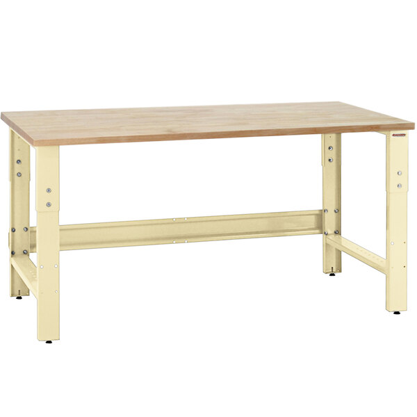 A BenchPro Roosevelt workbench with a wooden top and metal legs.