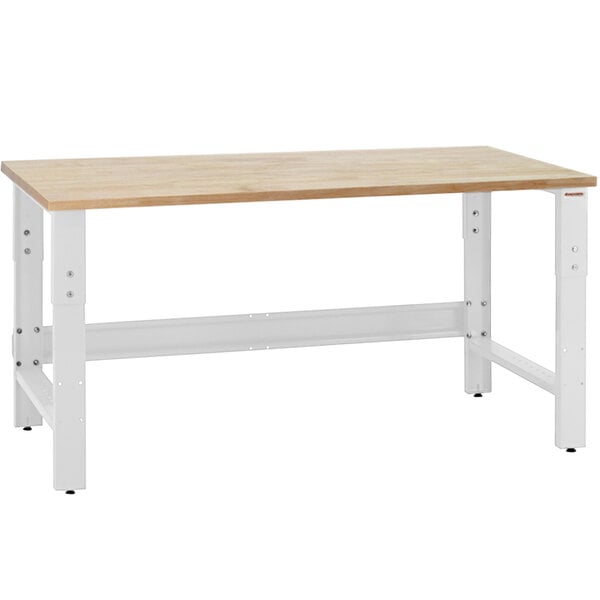 A white workbench with a wooden butcher block top.