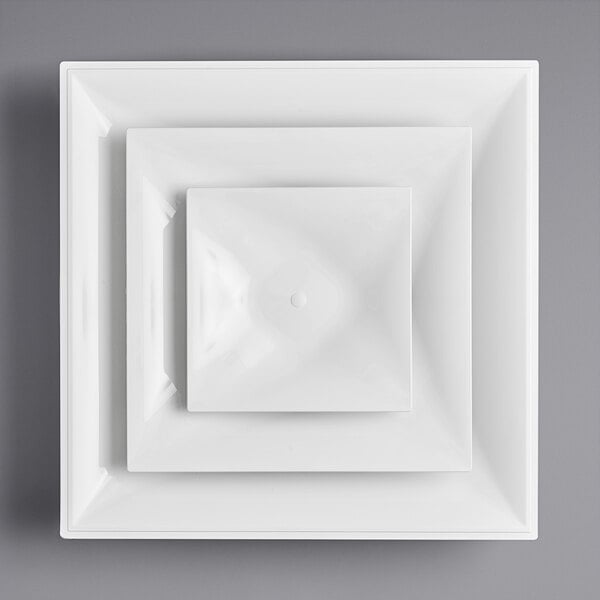 A white square plate with a white circle in the center.