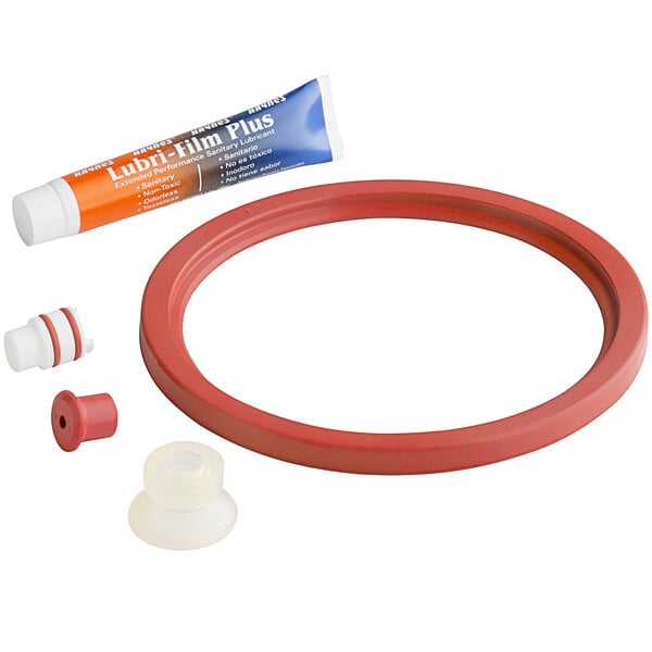 A red rubber seal with a tube of lubricant and a blue and red label.