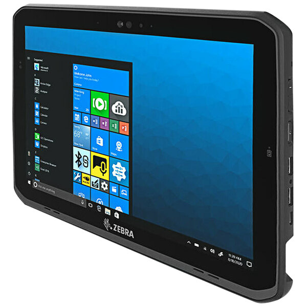 A black Zebra rugged 2-in-1 tablet with a blue screen on a table.
