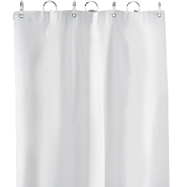 A white American Specialties, Inc. shower curtain hanging with silver rings.