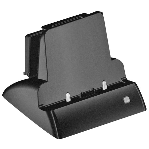 A black DT Research desktop charging cradle holding a black tablet.