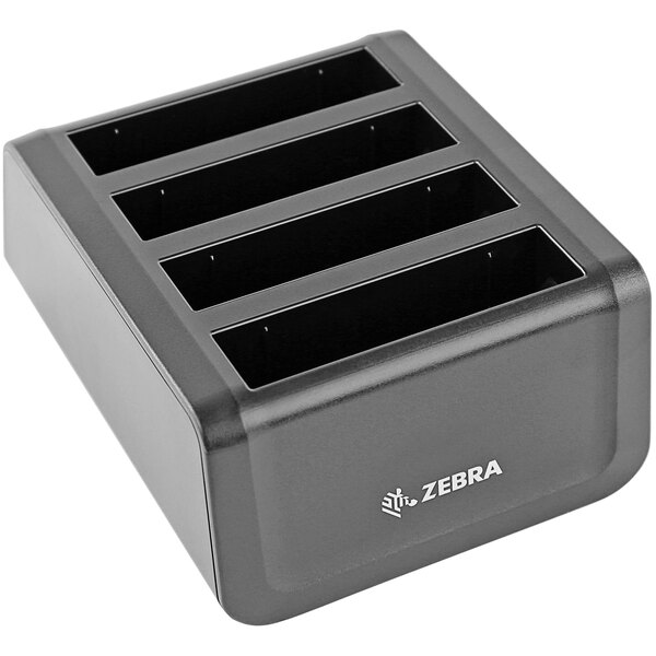 A black rectangular Zebra 4-slot battery charger.