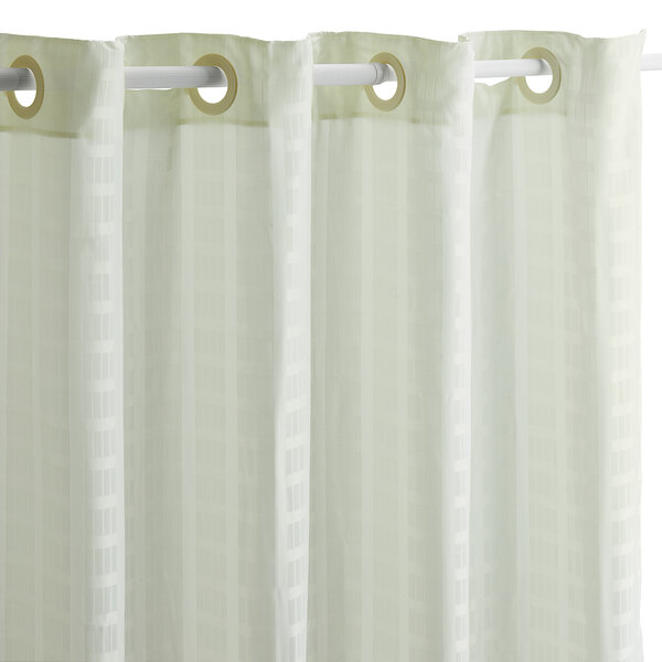 A beige Hookless shower curtain with rings on a rod.
