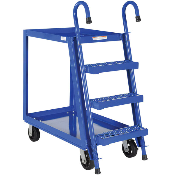 A blue steel Vestil stock picker cart with two shelves.