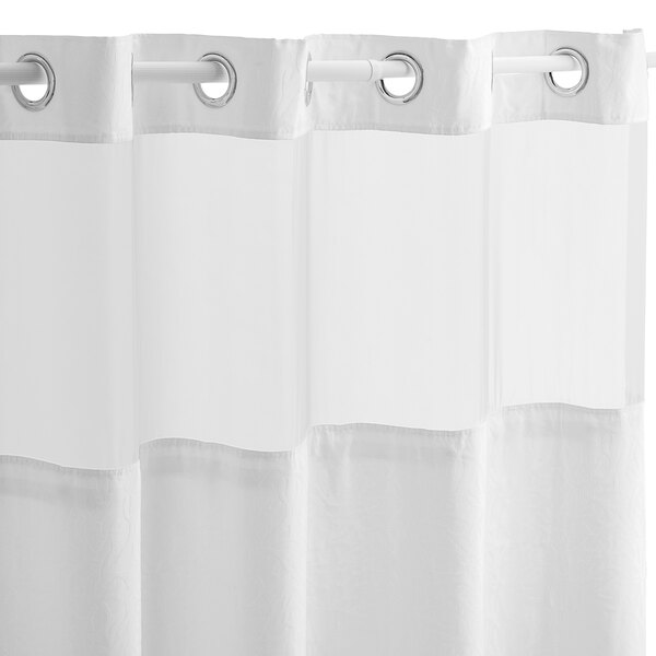 A Hookless white shower curtain with rings on a white background.