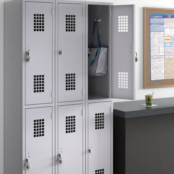 A group of unassembled Regency Space Solutions gray lockers.