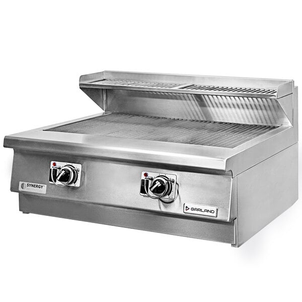 A stainless steel Garland countertop charbroiler with two knobs.