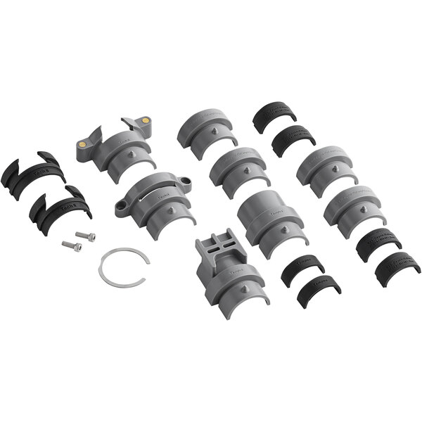 A group of grey plastic parts including pipes and clamps.