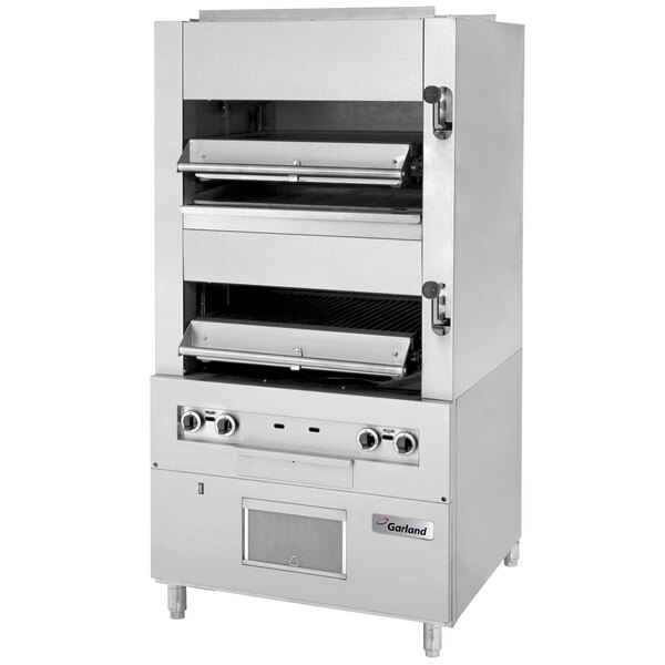 A large stainless steel Garland upright broiler with two broiling chambers.