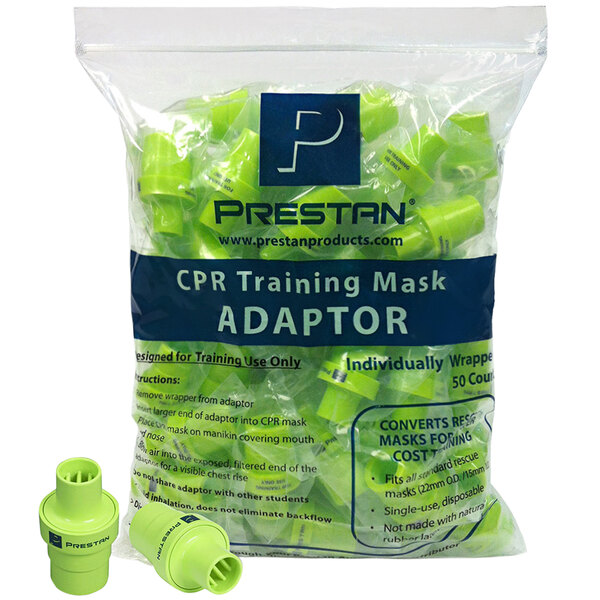 A bag of green Prestan CPR training mask adaptors with black text.