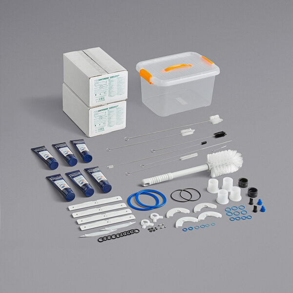 The Spaceman Starter Kit for Soft Serve Machines includes blue tubes with white and orange labels, a plastic container, and a syringe.