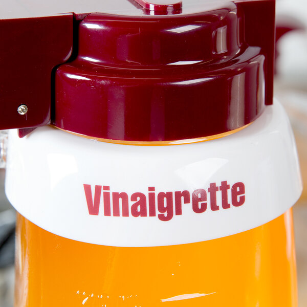 A Tablecraft white plastic collar with maroon "Vinaigrette" lettering.