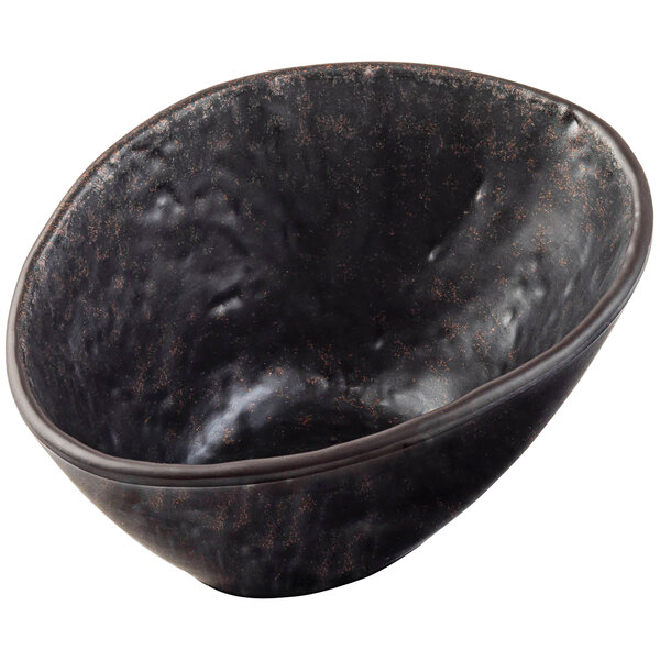 A brown melamine bowl with brown specks.