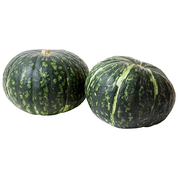 Two green and black kabocha squash on a white background.
