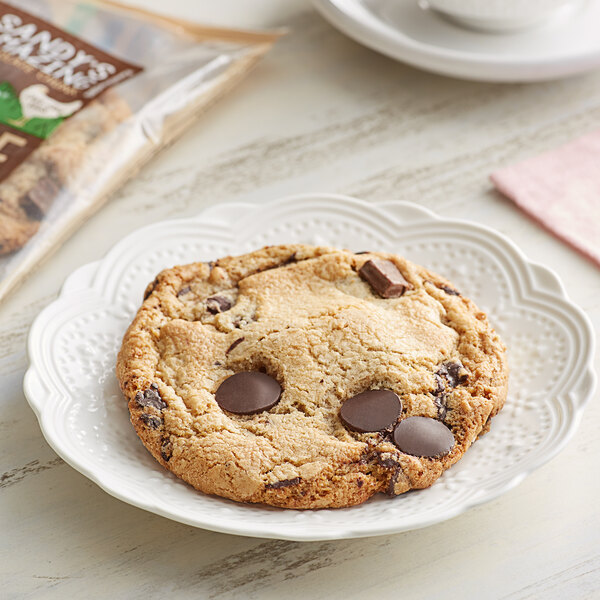 A Sandy's Amazing Chocolate Chunk cookie on a plate.