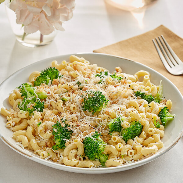 A plate of Barilla Protein+ Elbows pasta with broccoli and cheese.