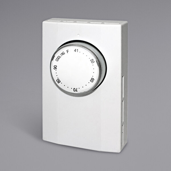 A King Electric single pole cooling thermostat with a white rectangular base and dial with black numbers.