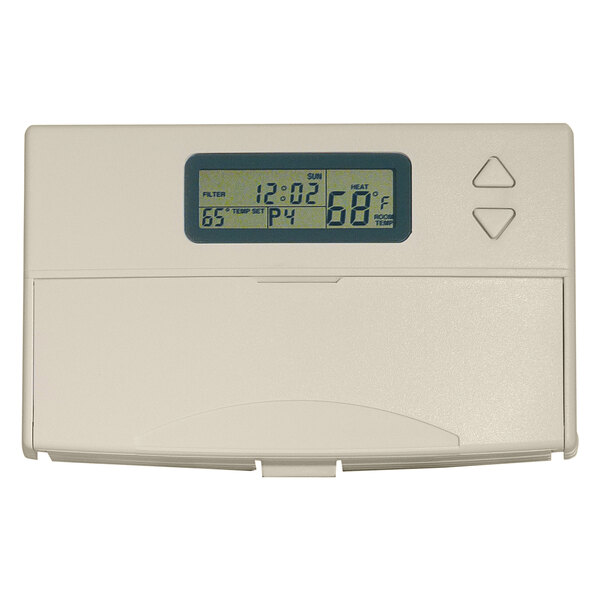 A white rectangular King Electric low voltage thermostat with a digital display.
