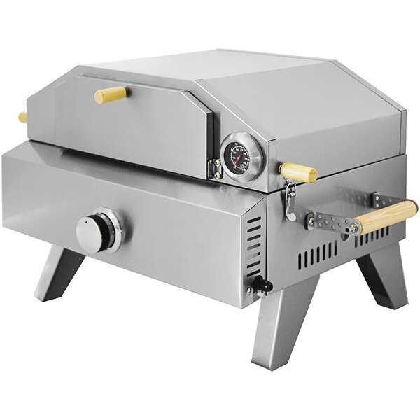 An Omcan stainless steel portable pizza oven with foldable legs.