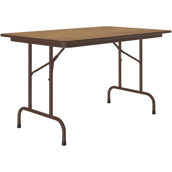 A Correll medium oak rectangular folding table with a brown metal frame.