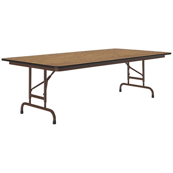 A Correll rectangular folding table with a oak top and metal legs.