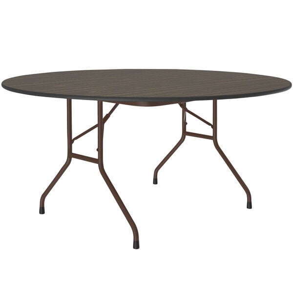 A Correll round folding table with a walnut top and brown frame.