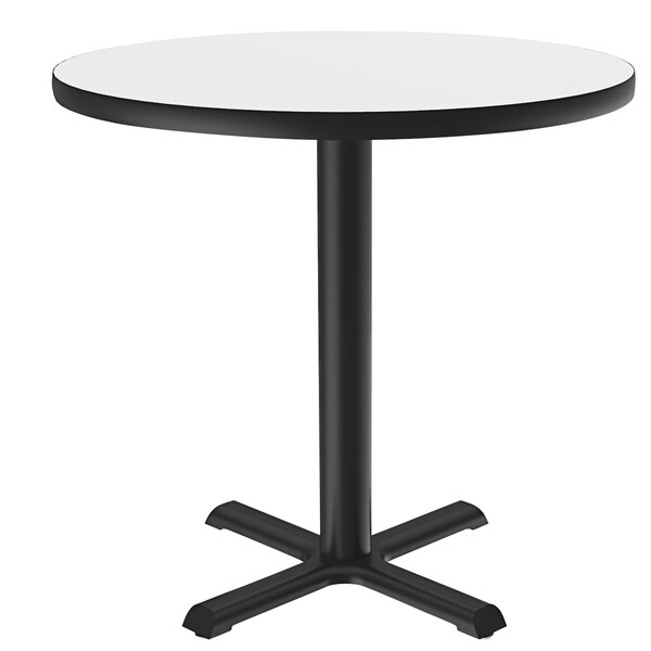 A Correll round table with a white high-pressure dry erase board top and black base.