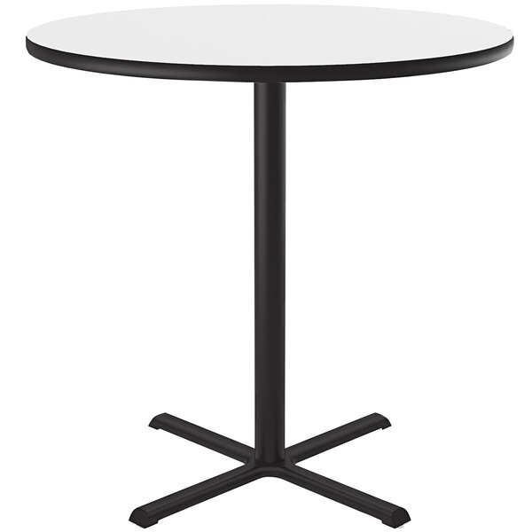 A Correll white bar height table with a white dry erase board top and a black base.