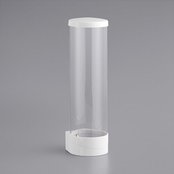 A white cylindrical object with a white cap containing a clear plastic container with a white lid.