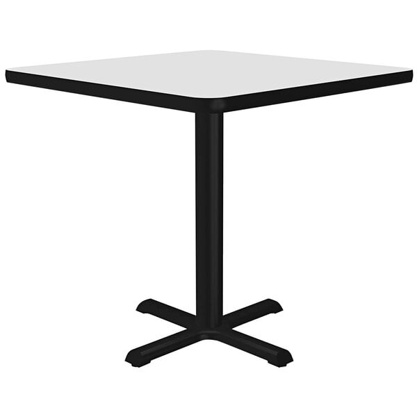 A white square table with black base.