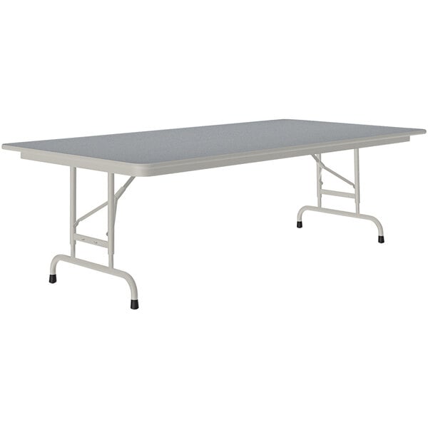 A rectangular table with a gray granite top and gray legs.