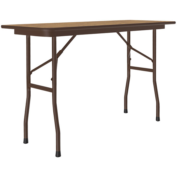 A brown Correll rectangular folding table with a wood finish.