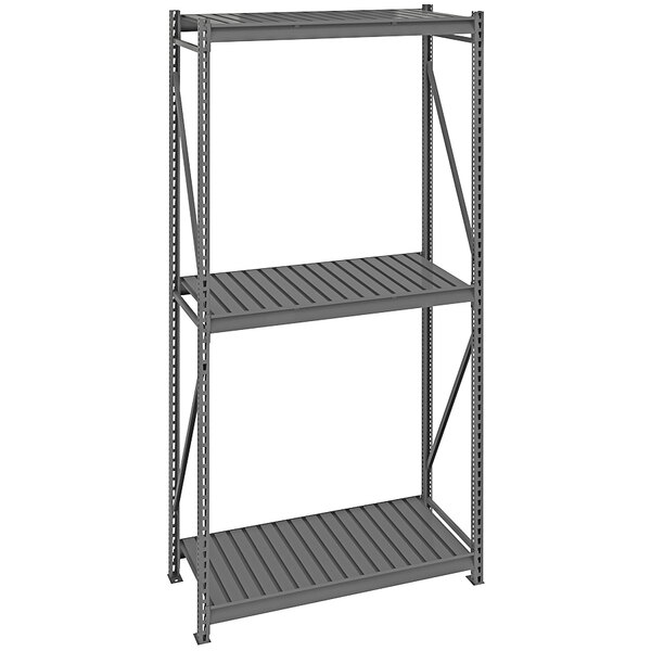 A dark gray Tennsco metal bulk shelving unit with corrugated decking on three shelves.