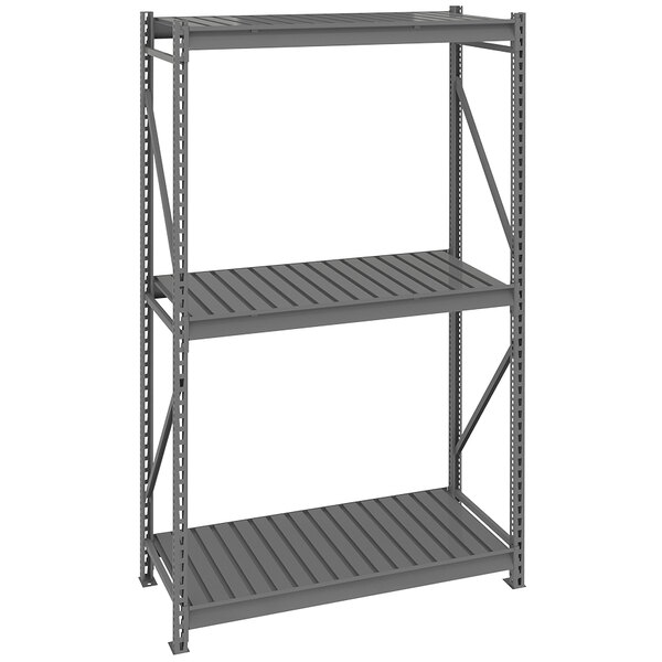 A dark gray metal Tennsco shelving unit with corrugated shelves.